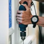 Handyman doing Door and Window Installation Services - One Call Dubai