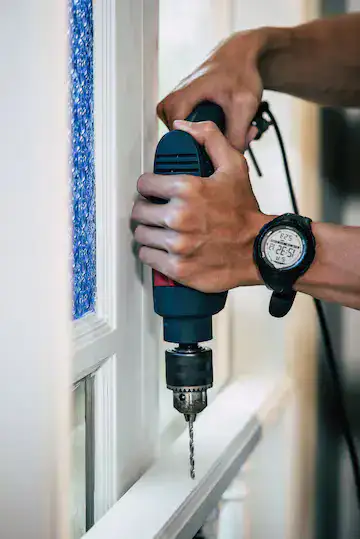 Handyman doing Door and Window Installation Services - One Call Dubai